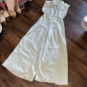 Sleeveless pearl snap jumpsuit. Wide leg